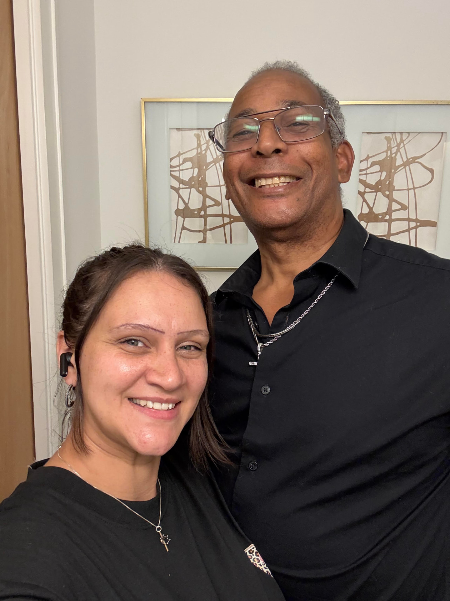 Gary and Frankie smiling together in black shirts